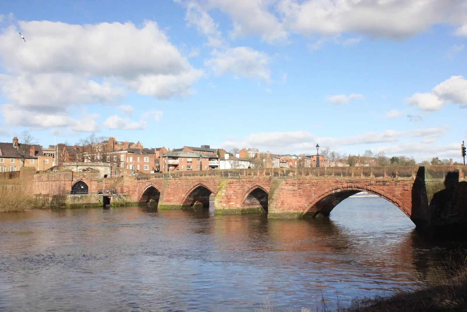 The Old Dee Bridge, Chester: a medieval red sandstone bridge of several arches over the River Dee.